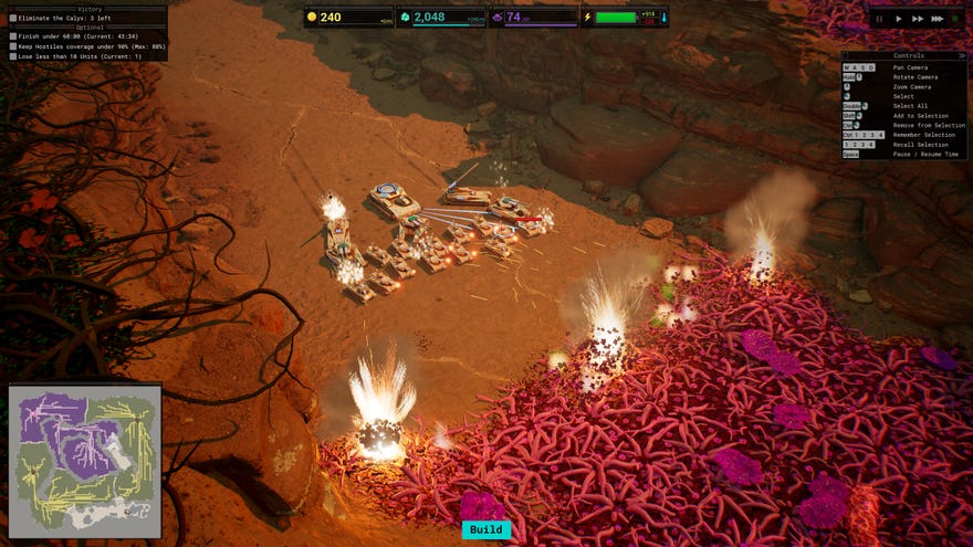 A group of tanks and artillery shooting at a huge mass of purple vegetation on a desert planet in strategy game Calyx