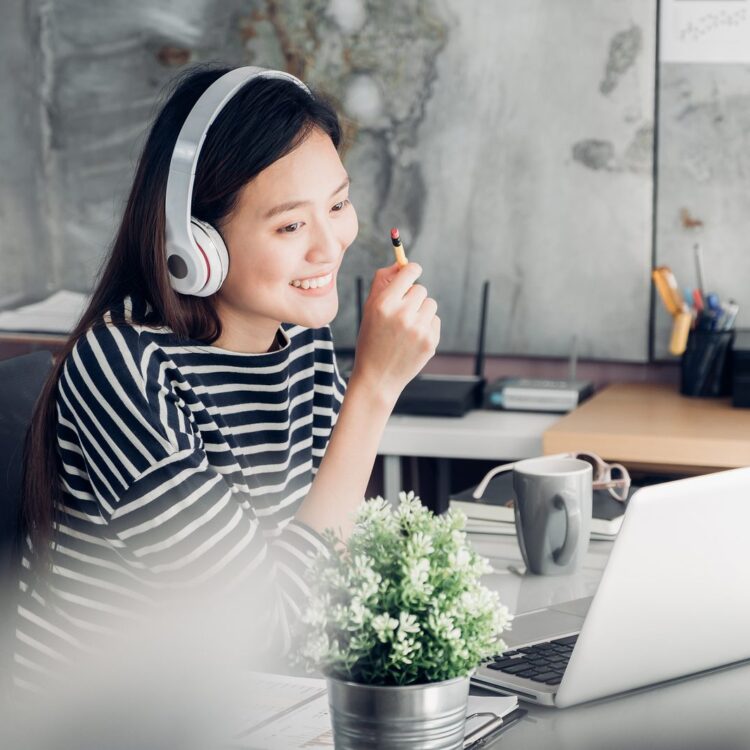 person working at computer smiling