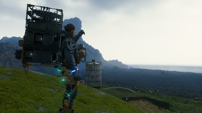 Sam looks out over a rocky landscape in Death Stranding Director's Cut