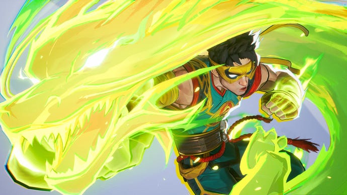 Iron Fist in Marvel Rivals summons a dragon of green energy with his punch towards the camera.