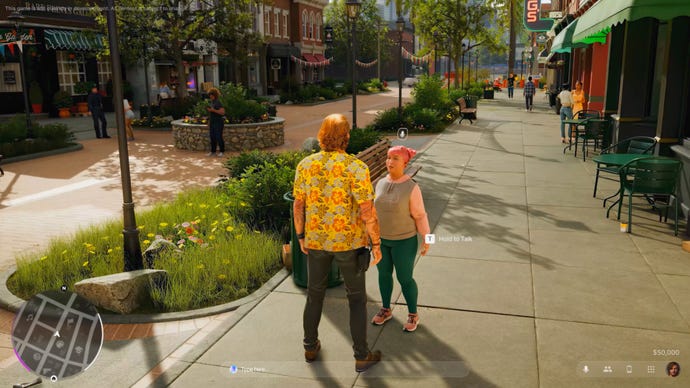 The player speaks to an NPC on a city street in sunny weather.