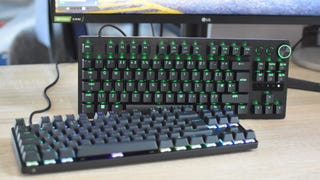 Two Snap Tap keyboards, the Razer Huntsman V3 Pro Tenkeyless and the SteelSeries Apex Pro TKL Wireless, on a desk.