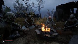 Sitting round a campfire with some fellower stalkers in S.T.A.L.K.E.R. 2: Heart of Chornobyl.