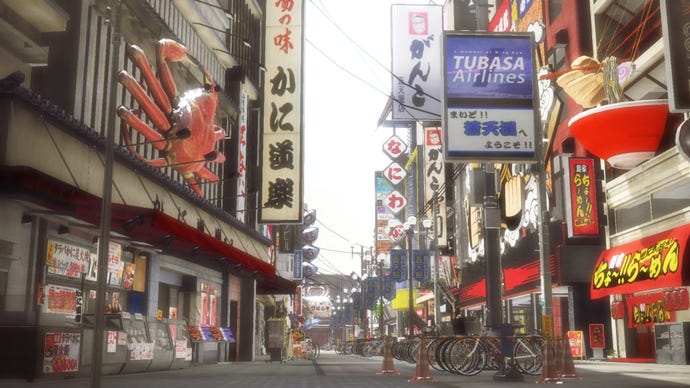 A city street from Yakuza 5, filled with colourful shops and signs.